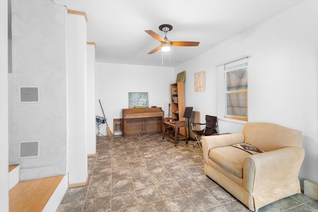 living area with ceiling fan