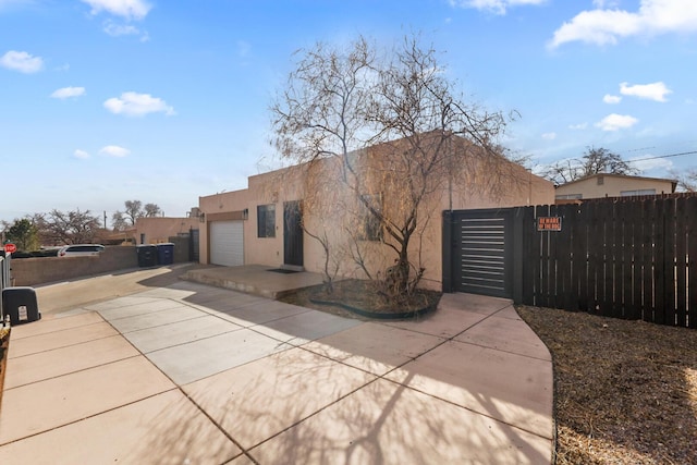 back of property featuring a garage