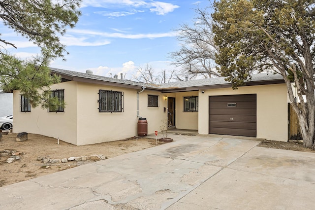 ranch-style home featuring a garage