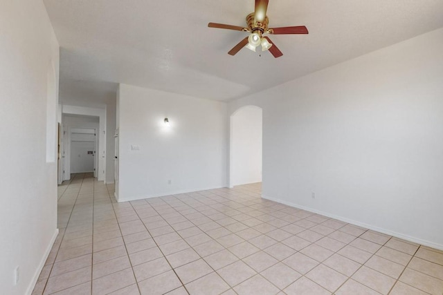 empty room featuring ceiling fan and light tile patterned floors