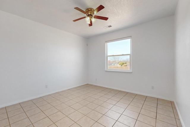 spare room featuring a textured ceiling and ceiling fan