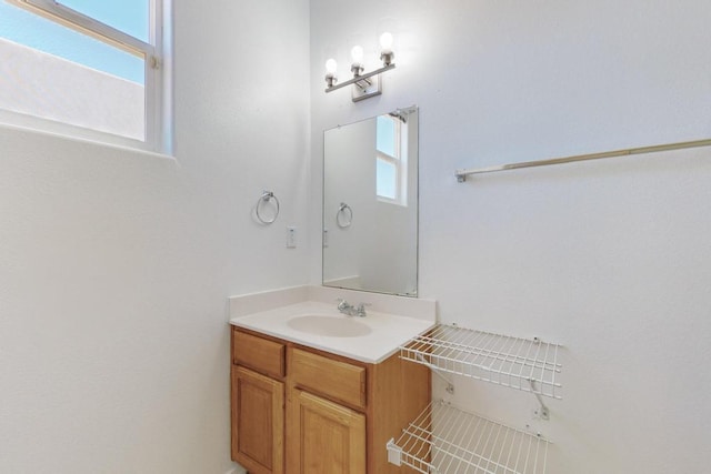 bathroom featuring vanity and a wealth of natural light