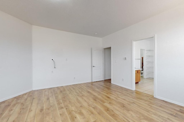 spare room with light wood-type flooring