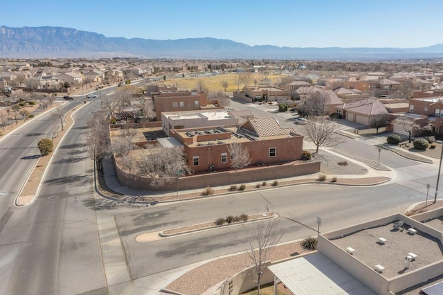 birds eye view of property featuring a mountain view