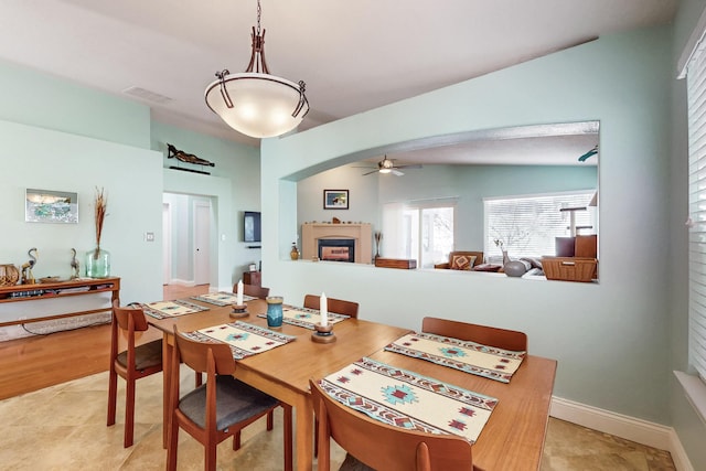 dining room featuring ceiling fan