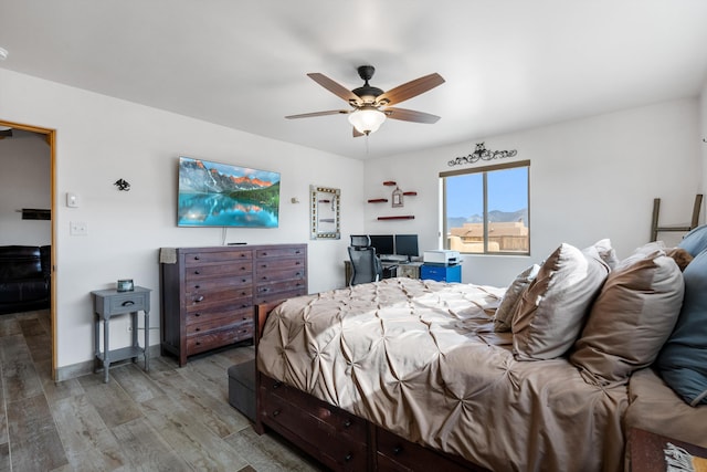 bedroom featuring hardwood / wood-style flooring and ceiling fan