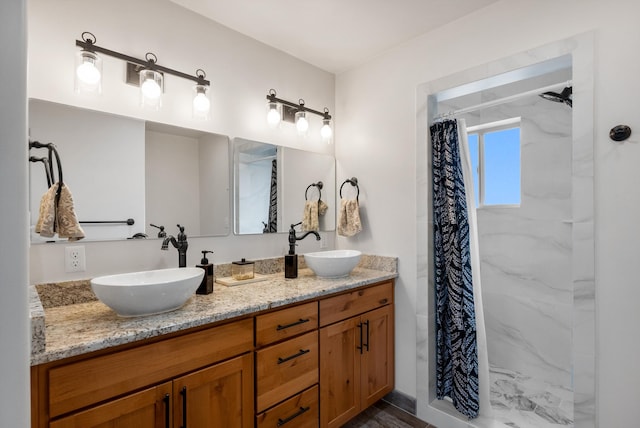 bathroom featuring vanity and a shower with shower curtain