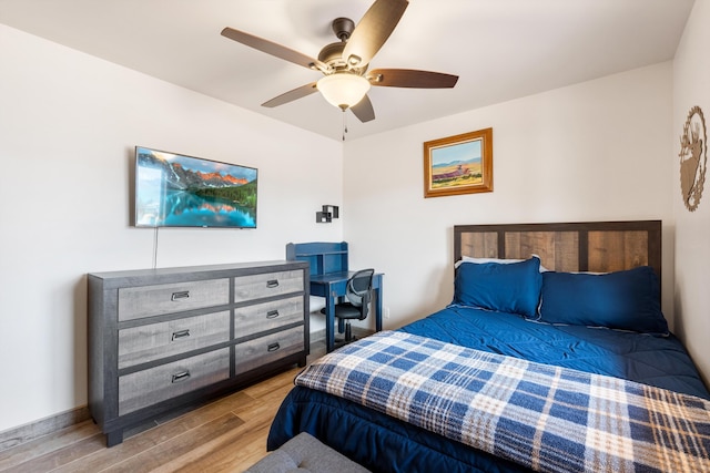 bedroom with light hardwood / wood-style flooring and ceiling fan