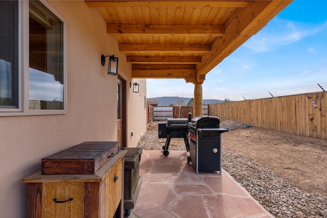 view of patio / terrace featuring a mountain view