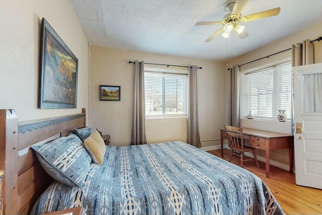 bedroom featuring wood-type flooring and ceiling fan