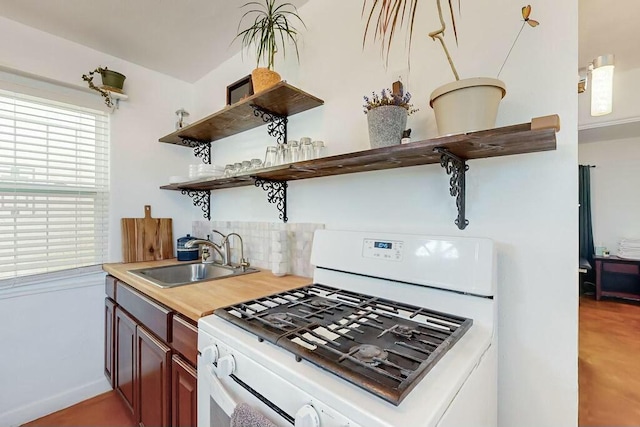 kitchen with sink and gas range gas stove