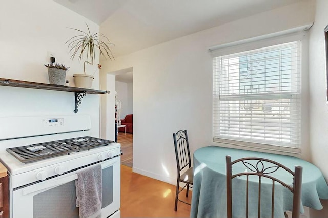 kitchen featuring light hardwood / wood-style floors and gas range gas stove