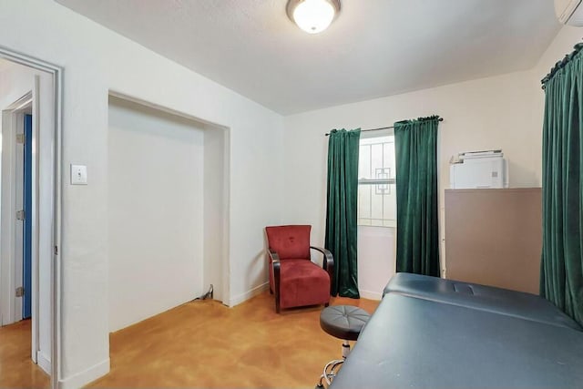 carpeted office featuring a wall mounted air conditioner