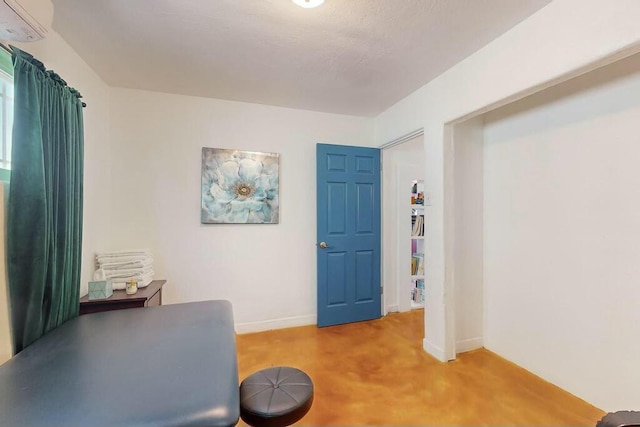 office space with concrete flooring and an AC wall unit