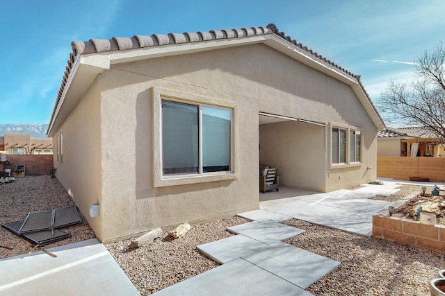 view of property exterior featuring a patio