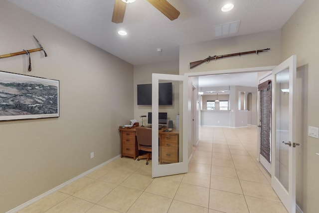 tiled home office featuring french doors and ceiling fan