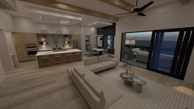 living room featuring sink, ceiling fan, beam ceiling, light hardwood / wood-style floors, and a high ceiling