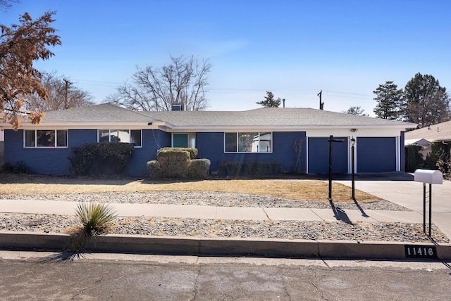 ranch-style home featuring a garage