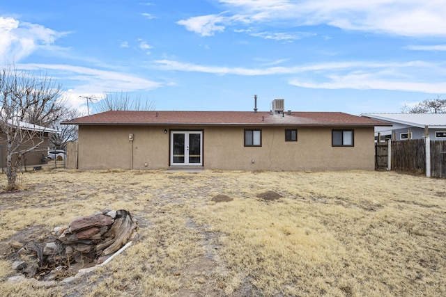 rear view of property with central air condition unit