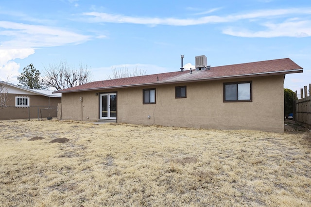 back of house with central AC