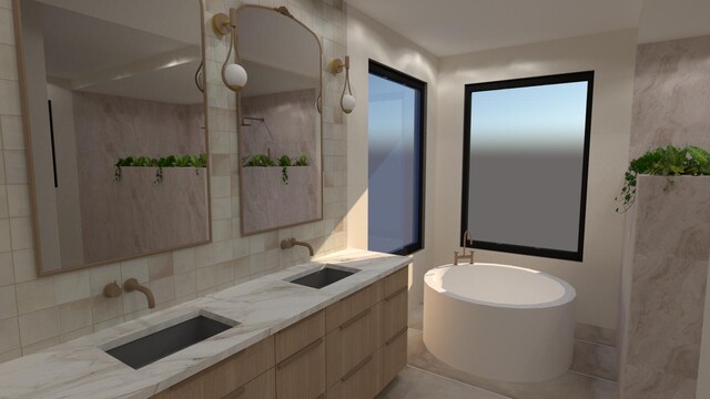 full bathroom featuring a sink, a freestanding tub, double vanity, and decorative backsplash