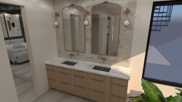 ensuite bathroom with tile patterned flooring, double vanity, tasteful backsplash, and a sink