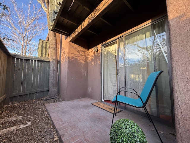 view of patio featuring fence