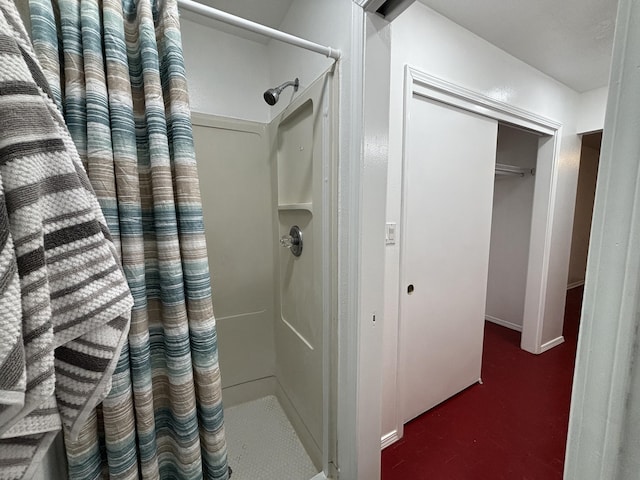 full bath with a shower stall