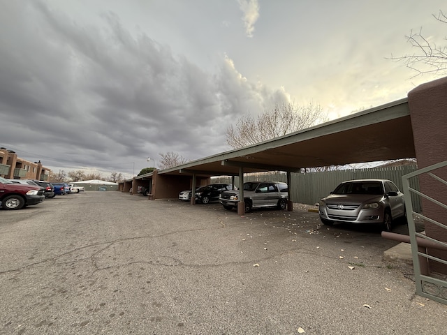 view of partially covered parking lot