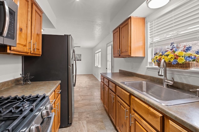 kitchen with appliances with stainless steel finishes and sink