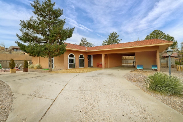 view of front of home featuring a carport