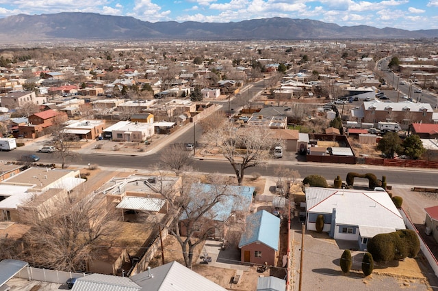 birds eye view of property with a mountain view