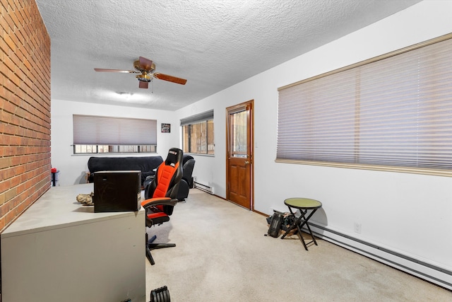 office featuring light colored carpet, a textured ceiling, and baseboard heating