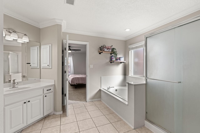 bathroom featuring tile patterned floors, a textured ceiling, ornamental molding, vanity, and ceiling fan