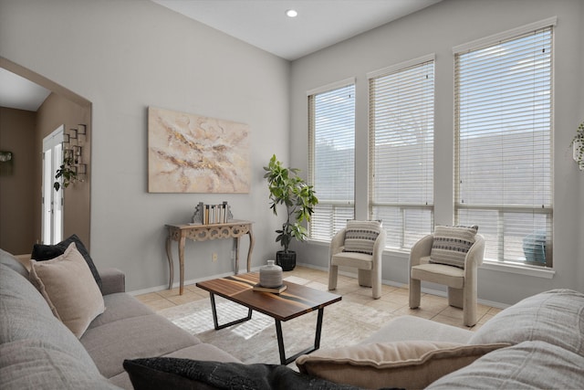 living room featuring light tile patterned floors and a wealth of natural light