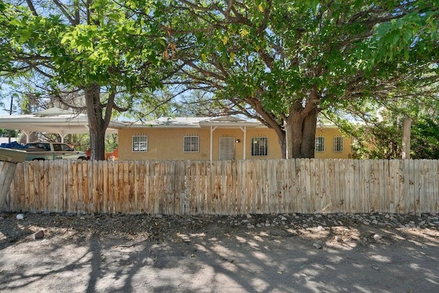 view of front of home with a carport