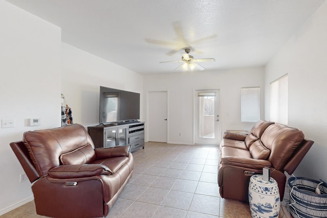 living room with light tile patterned floors and ceiling fan