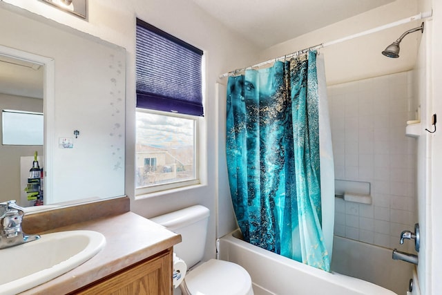 full bathroom featuring toilet, shower / bath combo with shower curtain, and vanity