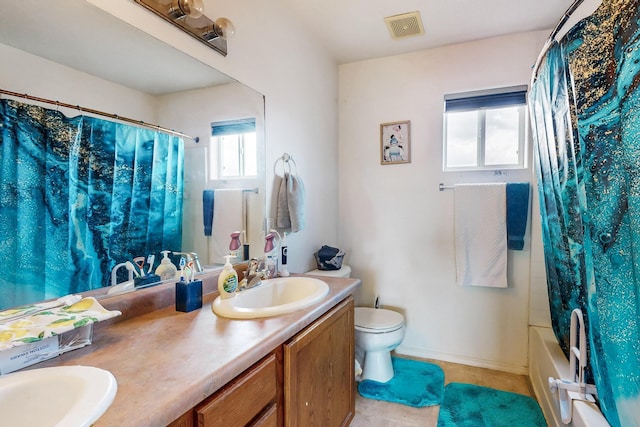 full bathroom featuring toilet, vanity, and shower / bath combo with shower curtain