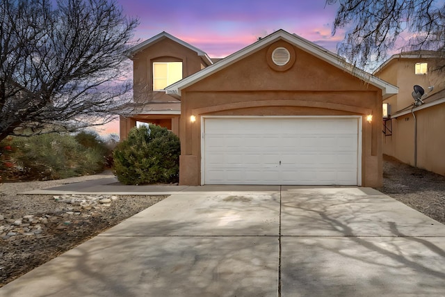 front of property with a garage