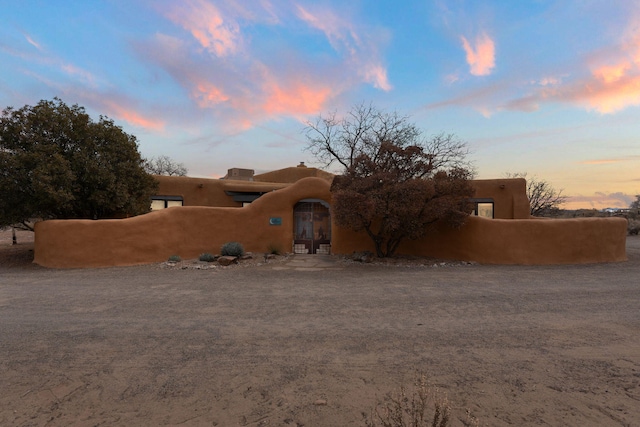 8008 Loma Larga Rd, Corrales, NM 87048 - pueblo revival-style home with french doors