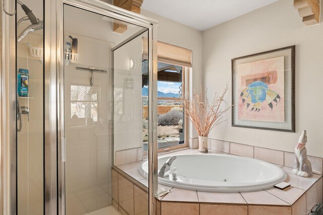 8008 Loma Larga Rd, Corrales, NM 87048 - full bath featuring a shower stall and a jetted tub
