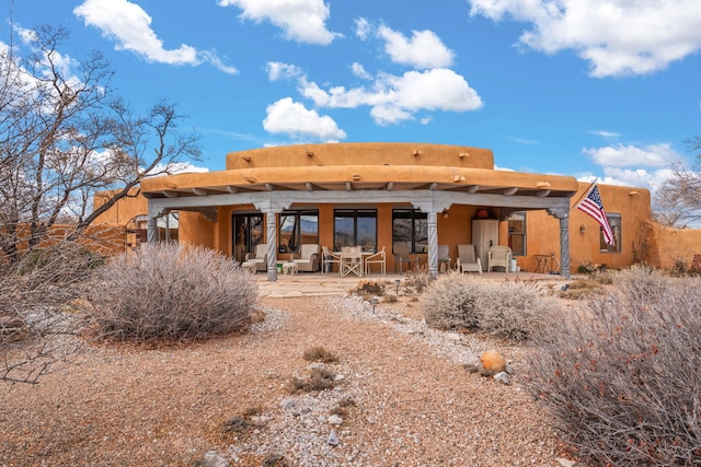 8008 Loma Larga Rd, Corrales, NM 87048 - rear view of property featuring a patio area