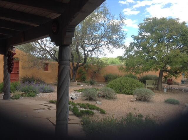 8008 Loma Larga Rd, Corrales, NM 87048 - view of yard featuring a patio area
