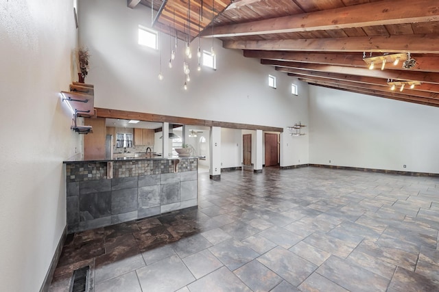 interior space with baseboards, visible vents, high vaulted ceiling, beam ceiling, and wood ceiling