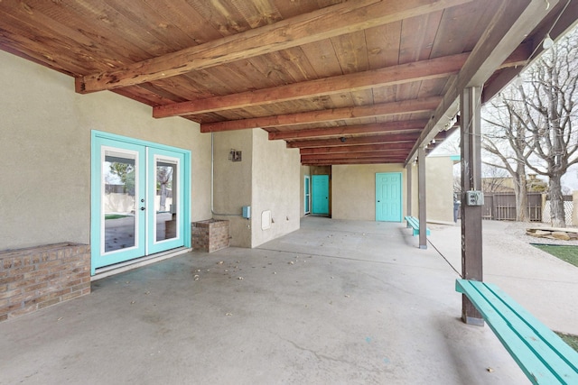 view of patio / terrace featuring french doors and fence