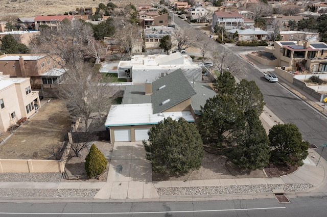 birds eye view of property with a residential view