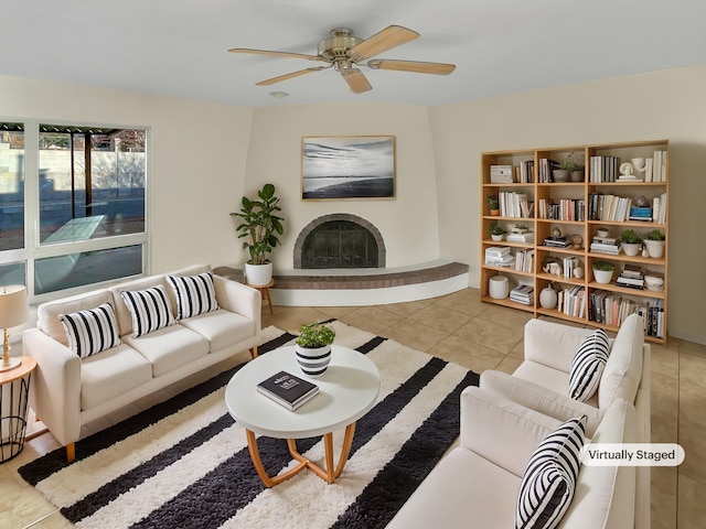 living room with ceiling fan and light tile patterned floors