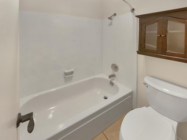 bathroom featuring toilet, tile patterned flooring, and shower / bathing tub combination