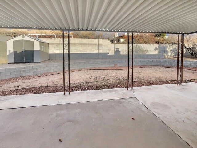 view of patio / terrace featuring a shed